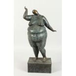 AN ABSTRACT BRONZE STANDING FAT NUDE on a bronze base, 18ins high.