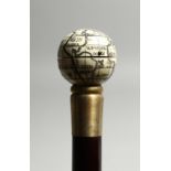 A BONE WALKING STICK ' GLOBE AND COMPASS'