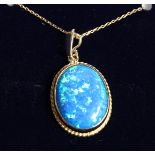 A 9CT. GOLD OPAL PENDANT AND CHAIN