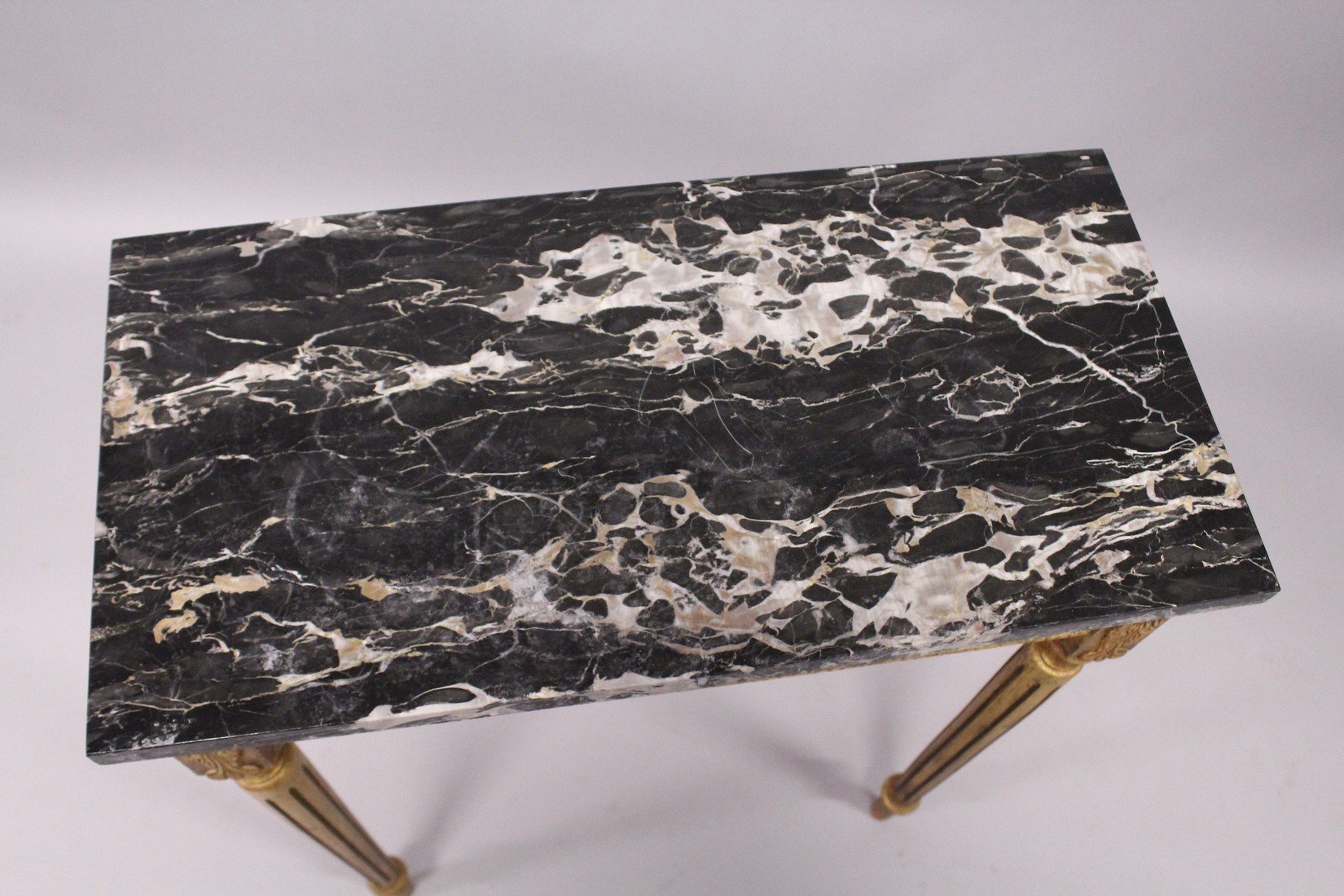 A SMALL GILDED SIDE TABLE, with marble top porcelain panels on turned tapering legs. 2ft long - Image 4 of 7