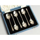 A SET OF SIX STERLING SILVER COFFEE SPOONS cased Birmingham 1957