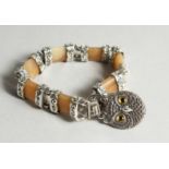 A SILVER AND AGATE TOGGLE BRACELET with owl lock