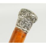A VICTORIAN CANE with silver handle. Sheffield, 1890. 34ins long.