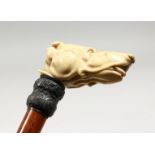 A VICTORIAN UMBRELLA with carved ivory dog handle, Engraved Charles Clark, Haywards Heath.