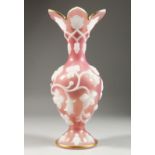 A GOOD BOHEMIAN PINK GLASS VASE, with pink flowers in relief. 11ins high
