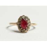 AN 18CT GOLD, RUBY AND DIAMOND CLUSTER RING
