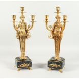 A VERY GOOD PAIR OF GILT BRONZE EMPIRE DESIGN, THREE LIGHT CANDLESTICKS with classical female, on