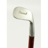 A SMALL WALKING STICK, the handle as a special metal golf club. 34ins long.