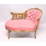 A VICTORIAN MAHOGANY PIERCED AND GILDED CHAISE LOUNGE, with button back and padded seat on