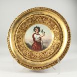 A SUPERB VIENNA PORCELAIN PLATE painted with a portrait of DISTAL holding a sprig of holly. 9.