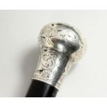 A VICTORIAN CANE with silver handle. Birmingham, 1871 35ins long.