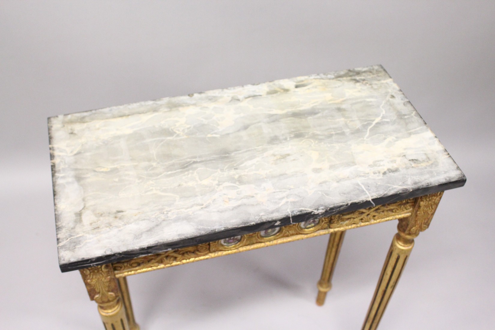 A SMALL GILDED SIDE TABLE, with marble top porcelain panels on turned tapering legs. 2ft long - Image 5 of 7