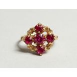 AN 18CT GOLD FIVE STONE RUBY CLUSTER RING