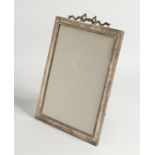 A GOOD GOLDSMITH AND SILVERSMITH CO. SILVER PHOTOGRAPH FRAME with ribbon motif. London 1910