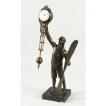 A BRONZE A SWINGING CLOCK. 12ins high.