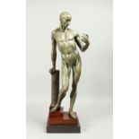 A FINE BRONZE ANATOMICAL STANDING MAN, beside a column on a stepped base. Signed FRANZ STUCK. No.