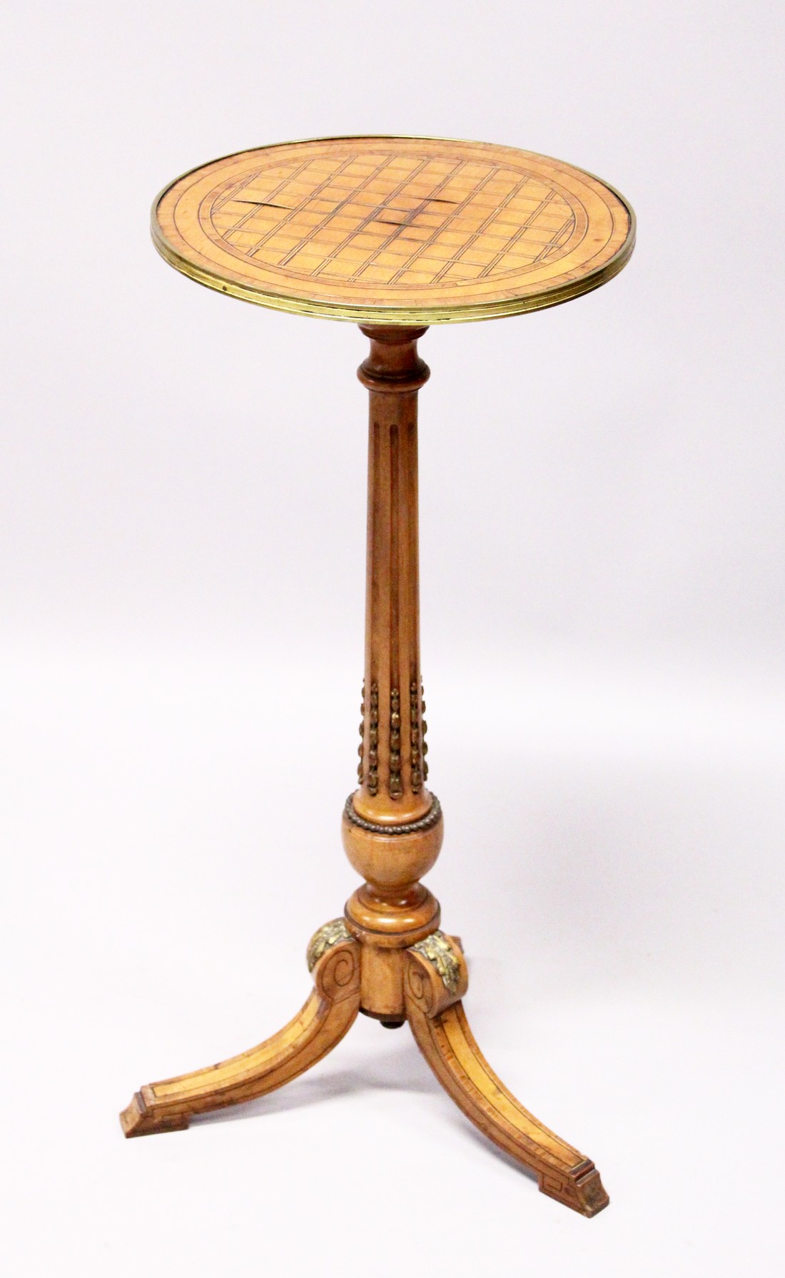 A GOOD 19TH CENTURY FRENCH CIRCULAR TOP TRIPOD TABLE, with cross hatch top, fluted column, ormalu