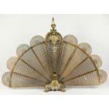 A VERY GOOD FRENCH ORMOLU PIERCED FAN SHAPED FIREGUARD, with masks on claw feet. 2ft 7ins high