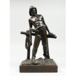 P. KOMDLEZEUSKI A BRONZE OF A FISHERMAN standing in front of a fence, signed, 12ins high, on a