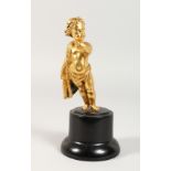 A 19TH CENTURY FRENCH ORMOLU PUTTI, on a wooden base. 5ins high,