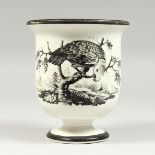 A CREMEWARE BEAKER, printed with a parrot and dove after Hancock. 5ins high.