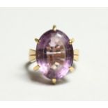 A 14CT GOLD SINGLE STONE AMRTHYST RING