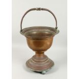 A DUTCH COPPER JARDINIERE with swing handle. 1ft 3ins high