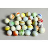 A COLLECTION OF THIRTY VARIOUS COLOURED MARBLES 1-1.5cm.