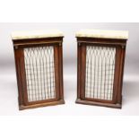 A GOOD PAIR OF REGENCY MAHOGANY PIER CABINETS with beige marble tops, brass grilled and pleated silk