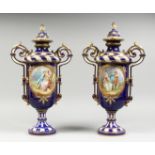 A SUPERB LARGE PAIR OF SEVRES TWO HANDLED VASES AND COVERS, rich blue and white ground edged in gilt