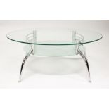 A MODERN GLASS AND CHROME TWO TIER OVAL COFFEE TABLE. 3ft 7ins long x 1ft 11.5ins wide x 1ft 5ins