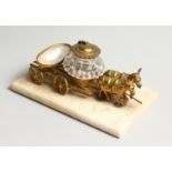 A SMALL FRENCH GILT AND MOTHER OF PEARL INKSTAND, two donkeys pulling a cart 5 ins long.