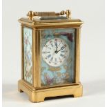 A MINIATURE SEVRES CARRIAGE CLOCK with flora porcelain panels. 2.25ins high.