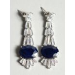 A PAIR OF SILVER LARGE SAPPHIRE DROP EAR RINGS