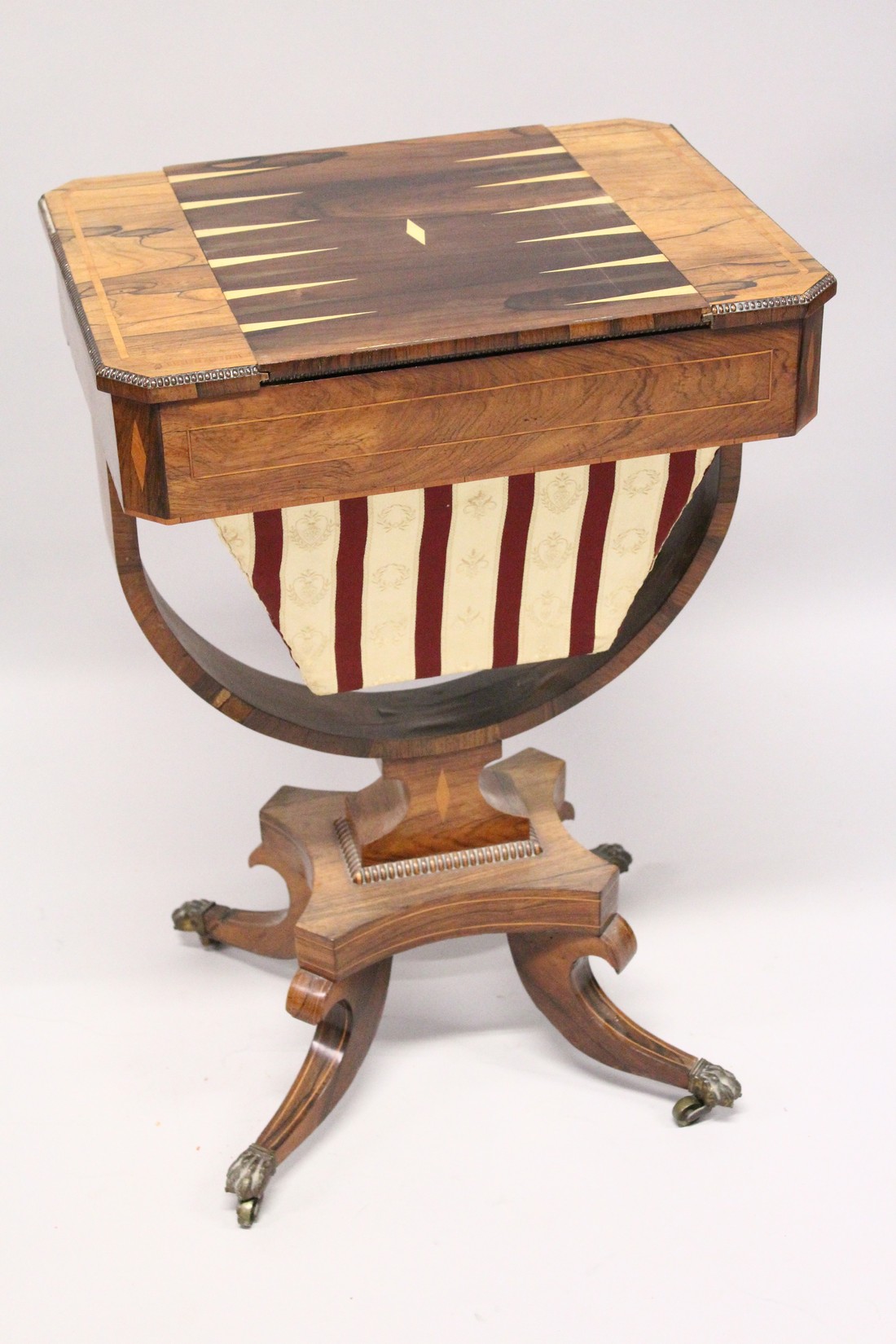 A REGENCY ROSEWOOD SEWING TABLE, with reversible Backgammon top , sliding drawer and sewing bag on - Image 7 of 9