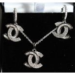 A SILVER CHANEL STYLE PENDANT, CHAIN AND EAR RINGS