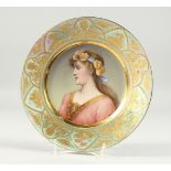 A SUPERB VIENNA PORCELAIN PLATE with a portrait of TUGEND, signed Enitsche with a lustre border. 9.