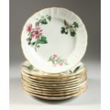 A SET OF TEN WEDGWOOD CIRCULAR BOTANICAL PLATES, each painted with flowers. Wedgwood mark in red