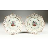 A PAIR OF SAMSON OF PARIS FAMILLE ROSE OCTAGONAL PLATES with roses. 9ins diameter