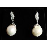 A PAIR OF BAROQUE PEARL EAR RINGS