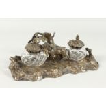 A GOOD BRONZE INKWELL, girl with a horse in a rustic setting. 9ins long.