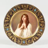 A GOOD VIENNA CIRCULAR PLATE, blue and gilt border, the centre painted with a portrait '