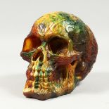 A LARGE RESIN SKULL 6ins long