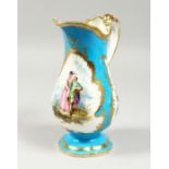 A GOOD PAIR OF SEVRES BLUE GROUND EWERS edged in gilt and painted with three panels of figures and