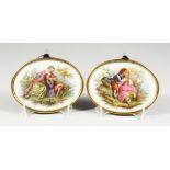 A GOOD PAIR OF 19TH CENTURY CONTINENTAL PORCELAIN OVALS of young lovers, in a gilt metal frame. 4