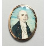AN 18TH CENTURY GOLD MOUNTED OVAL MINIATURE PORTRAIT half length of a man, the reverse with plated