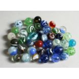 A COLLECTION OF FORTY VARIOUS COLOURED MARBLES 1-1.5cm.