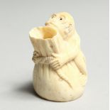 A CARVED BONE MONKEY VASE 2ins high