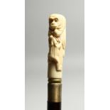 A BONE WALKING STICK 'MONKEY AND FROG 35ins long