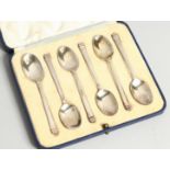 A SET OF SIX STERLING SILVER COFFEE SPOONS cased Sheffield 1914
